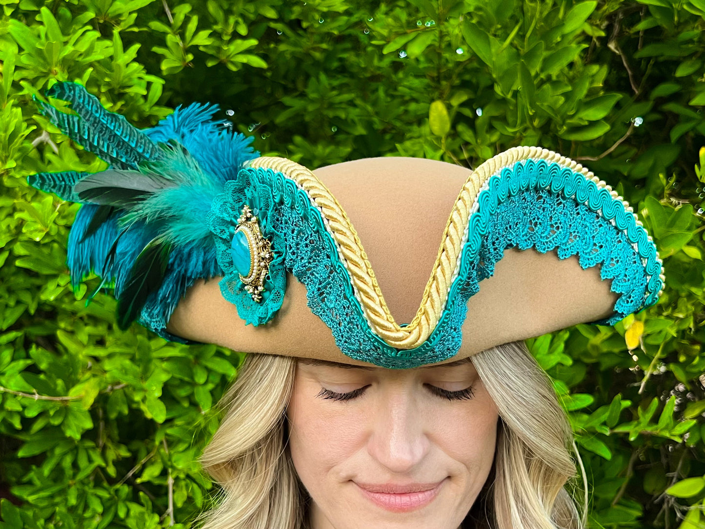 Tricorn Hat 22" Tan Polyester Base with Teal Trim, Feathers, and Turquoise Brooch