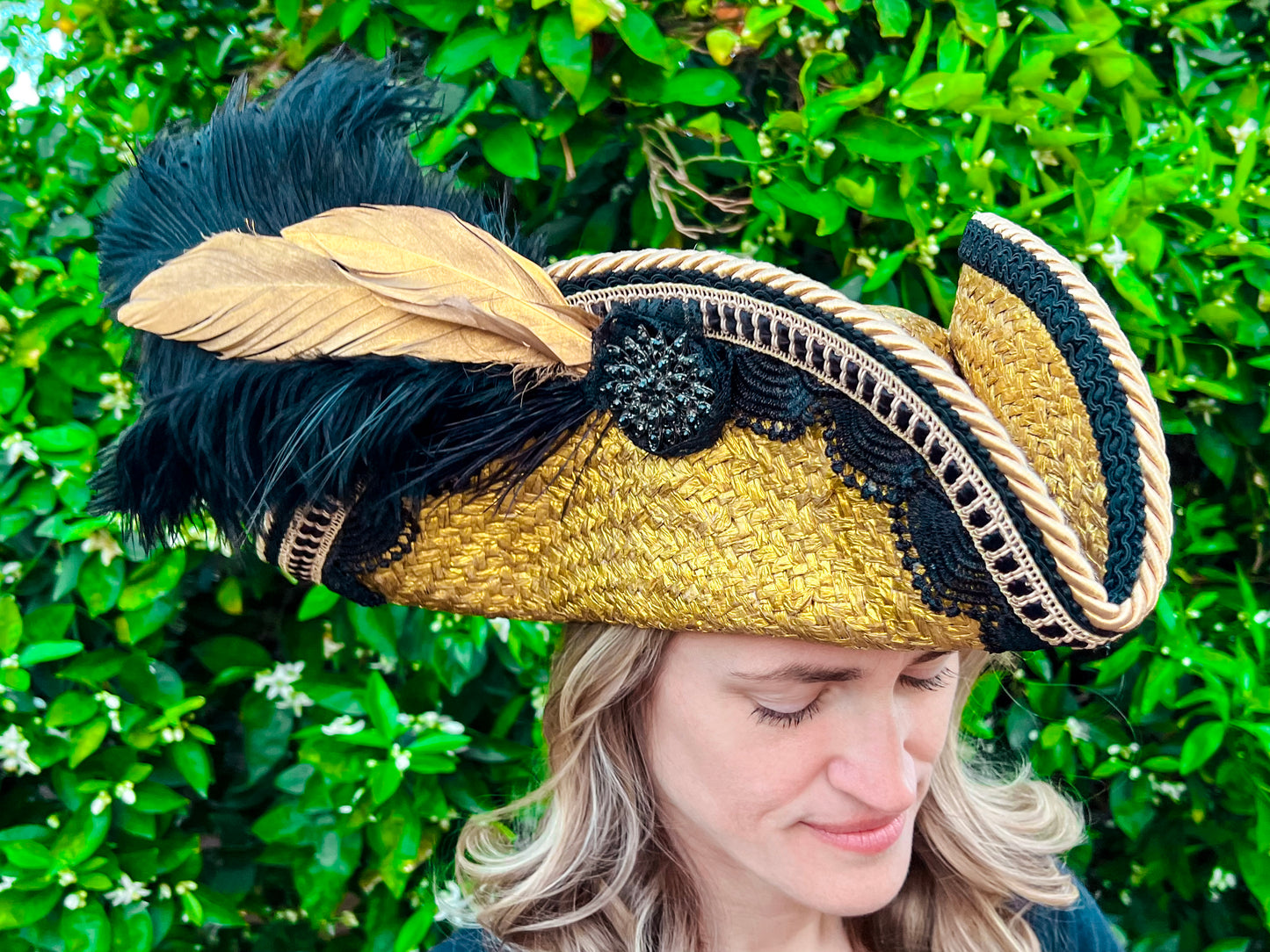 Tricorn Hat 21.75" Gold Straw Base with Black Trim, Feathers, and Rhinestone Brooch