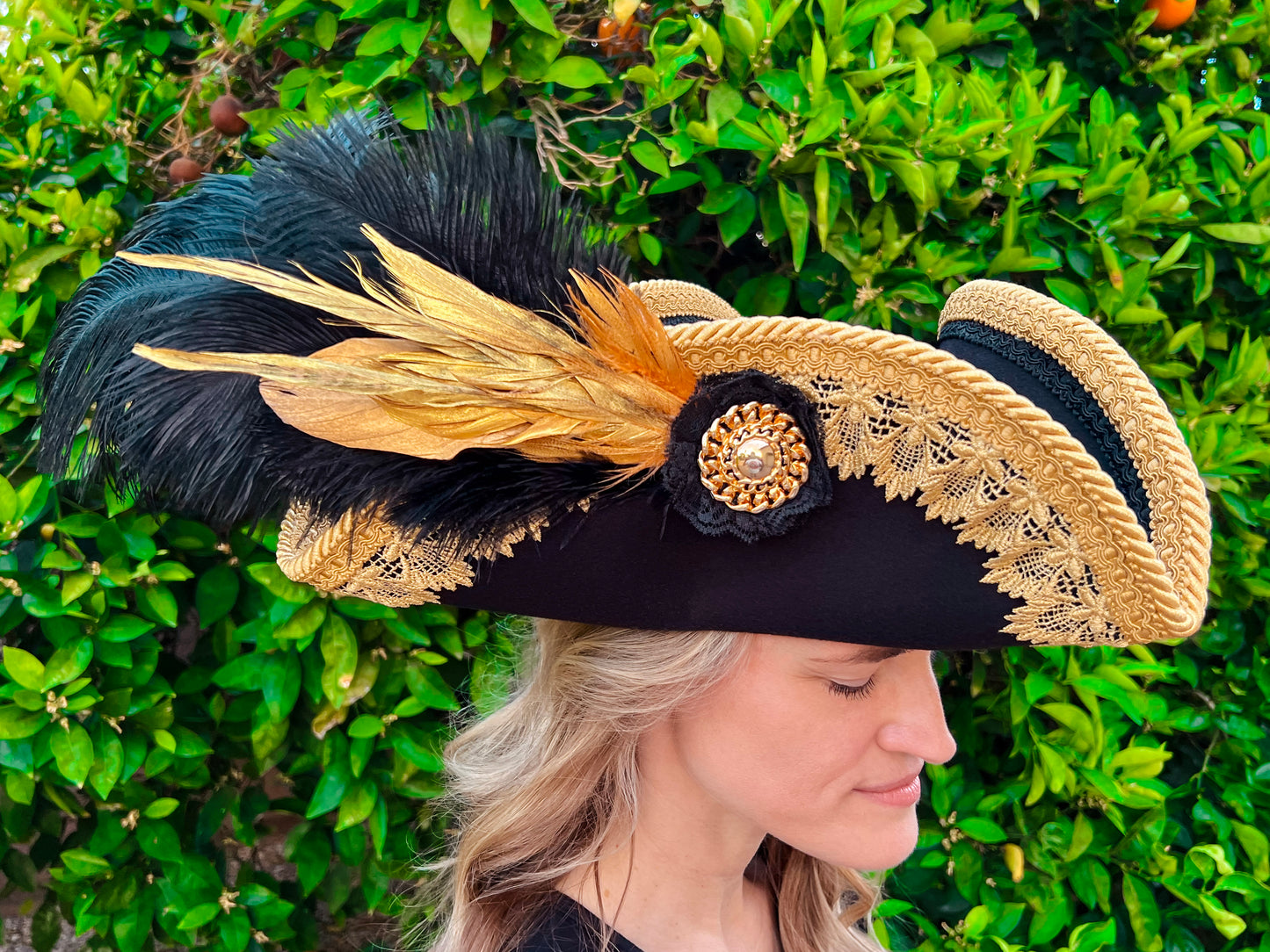 Tricorn Hat 22" Black Polyester Base with Gold Trim, Feathers, and Gold Brooch