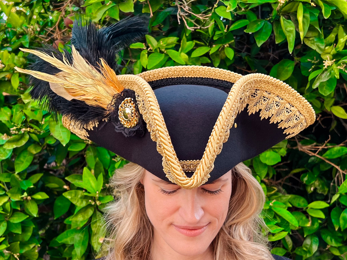 Tricorn Hat 22" Black Polyester Base with Gold Trim, Feathers, and Gold Brooch