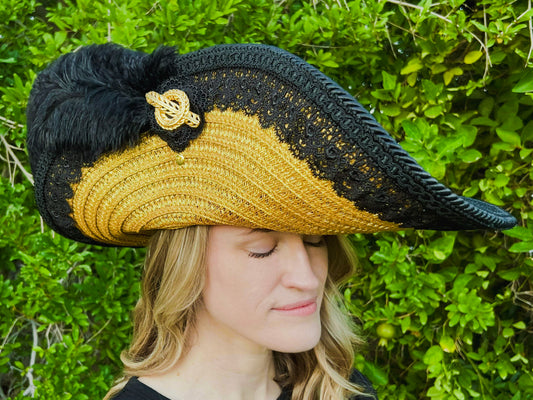 Cavalier Hat 21.75" Gold Polyester Base with Black Trim, Feathers, and Brooch