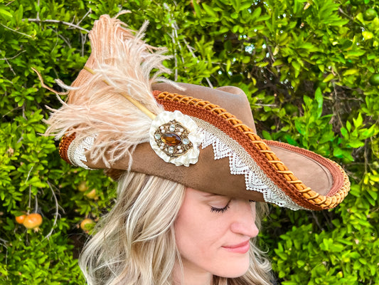 Cavalier Hat 22" Tan Suede Base with Rust Brown/White Trim, Feathers, and Brooch