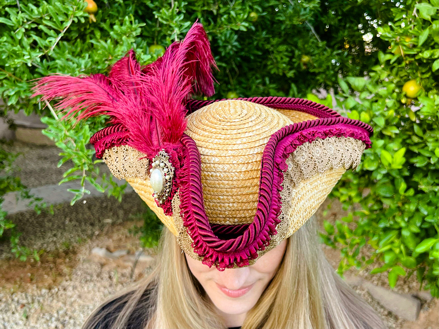 Tricorn Hat 21.75" Beige Straw Base with Maroon Trim, Feathers, and Pearl Brooch