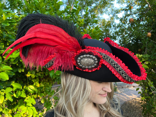 Tricorn Hat 21.25" Black Polyester Base with Red Ruffle Trim, Feathers, and Brooch