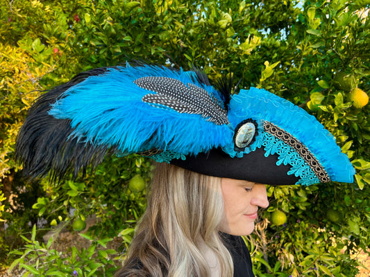 Tricorn Hat 22" Black Polyester Base with Turquoise Trim, Feathers, and Ship Brooch