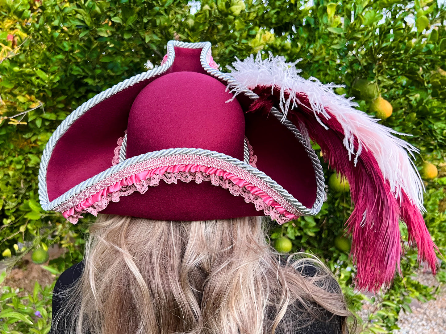 Tricorn Hat 22" Maroon Polyester Base with Pink Trim, Feathers, and Silver Brooch