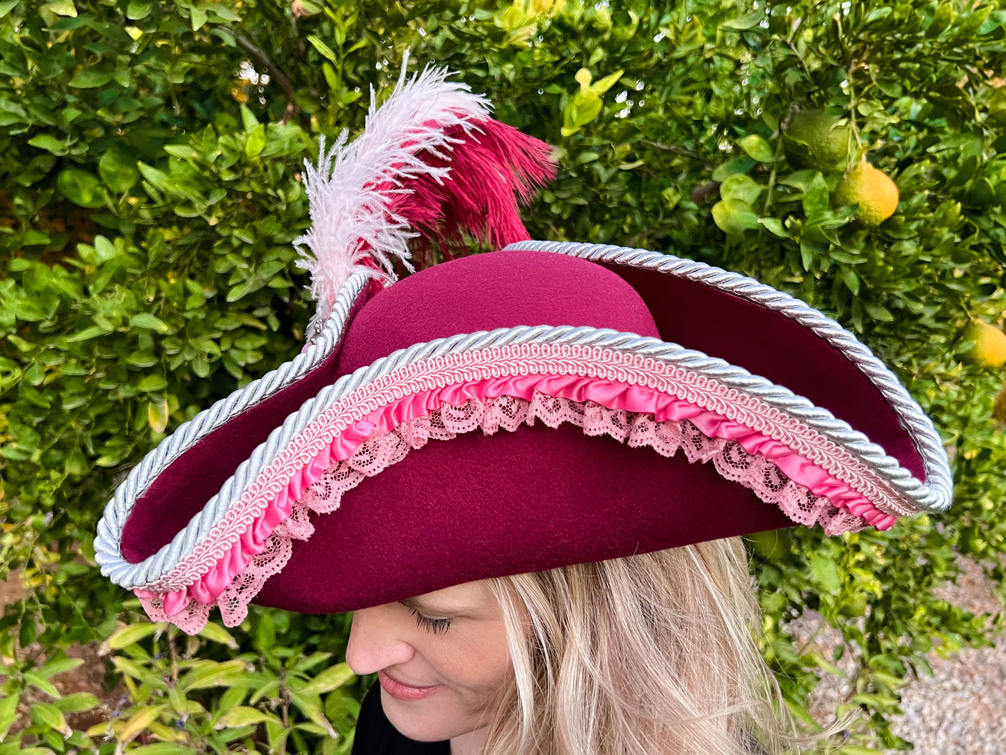 Tricorn Hat 22" Maroon Polyester Base with Pink Trim, Feathers, and Silver Brooch