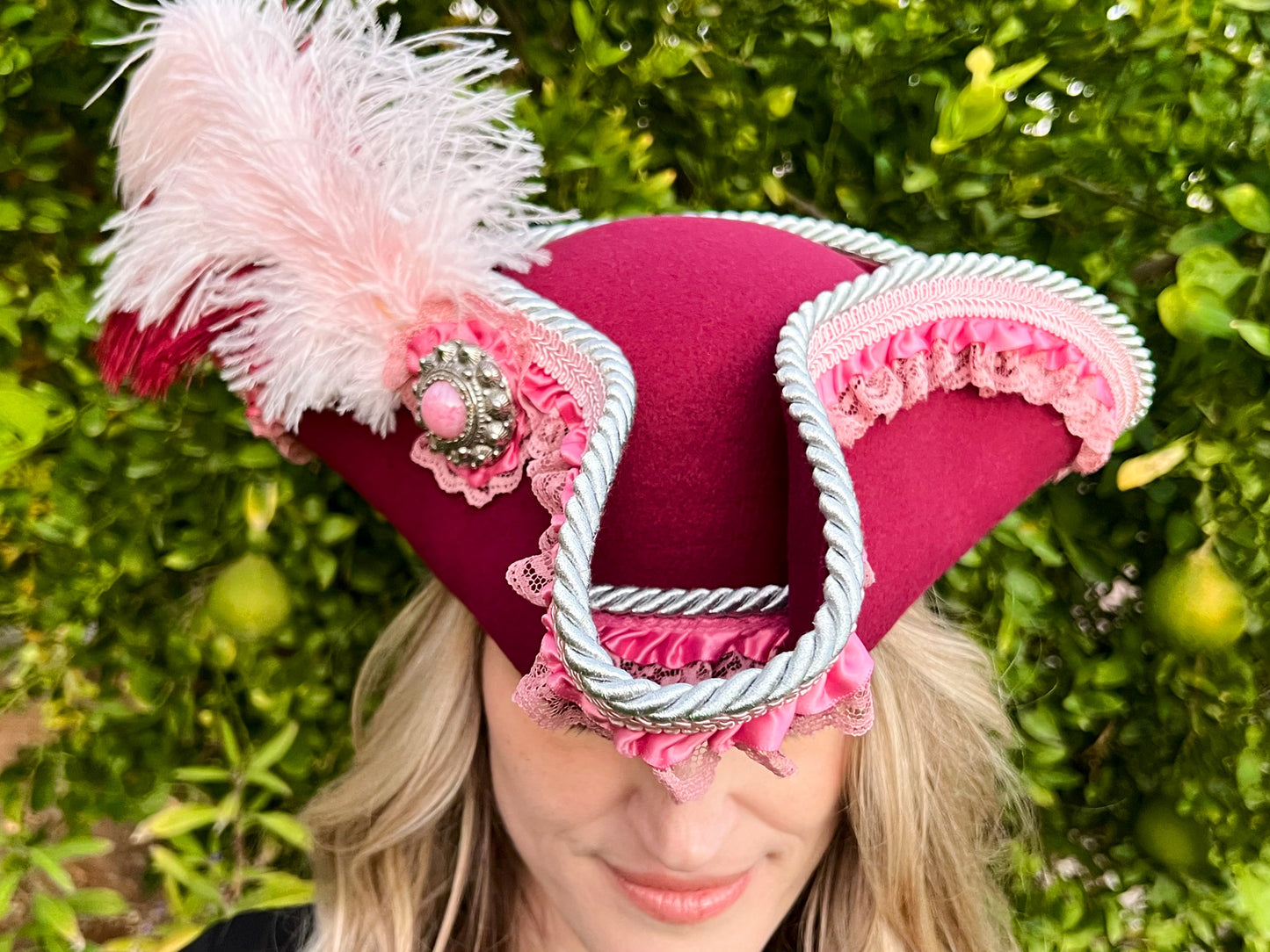 Tricorn Hat 22" Maroon Polyester Base with Pink Trim, Feathers, and Silver Brooch