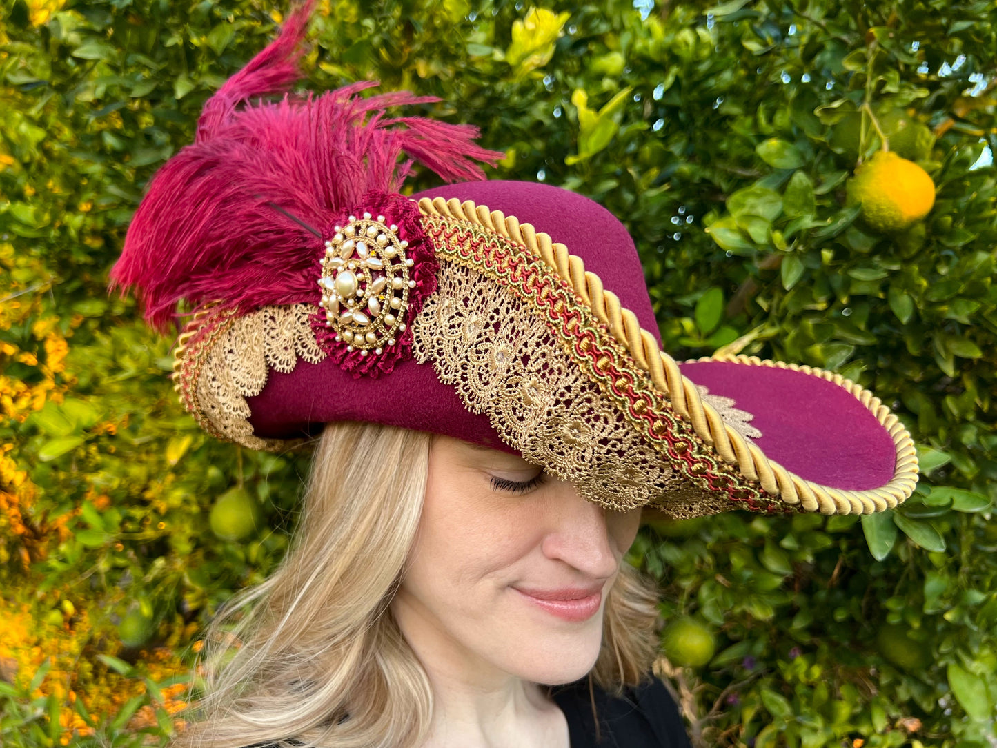 Cavalier Hat 22" Maroon Polyester Base with Gold Trim, Feathers, and Pearl Brooch