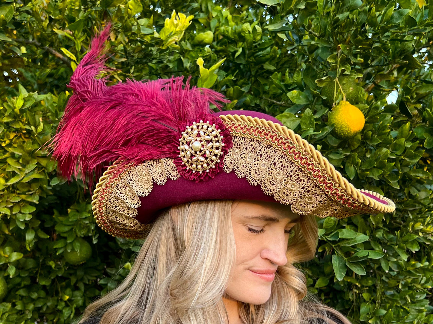 Cavalier Hat 22" Maroon Polyester Base with Gold Trim, Feathers, and Pearl Brooch