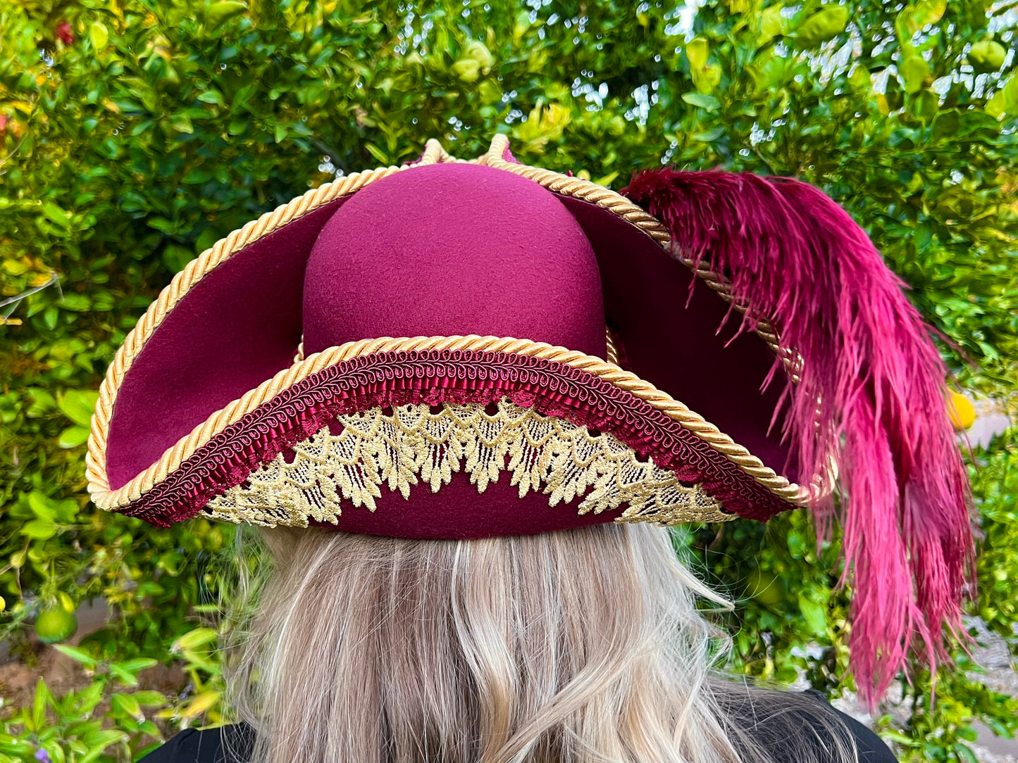 Tricorn Hat 22" Maroon Polyester Base with Gold Trim, Feathers, and Spiked Brooch