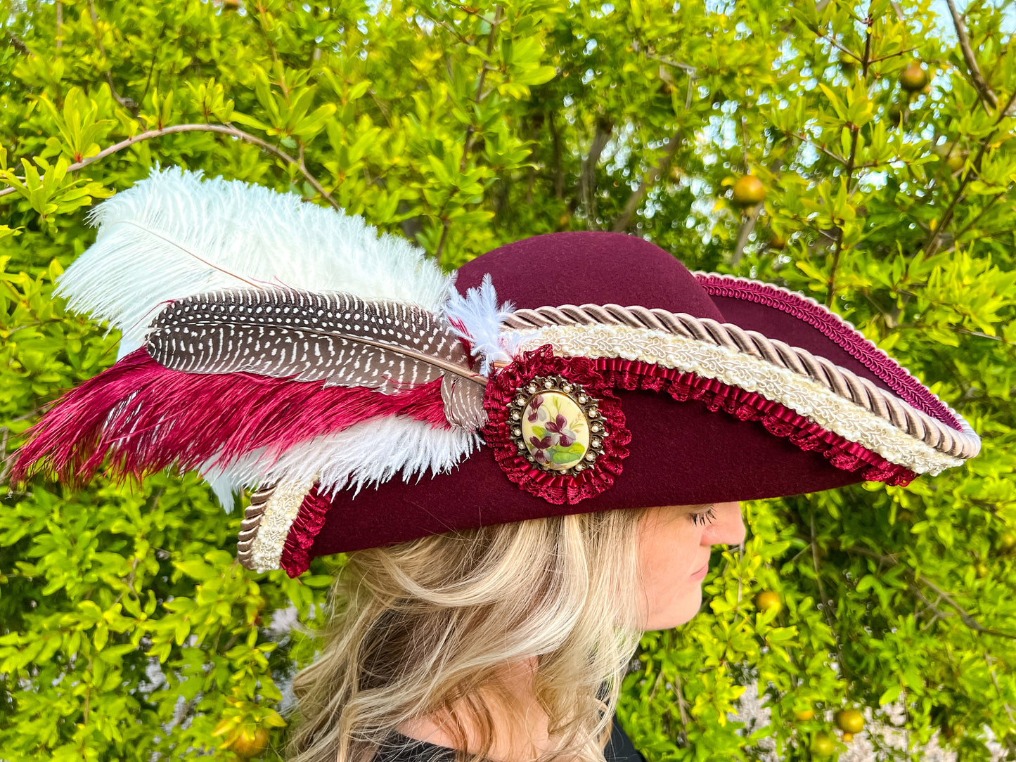 Cavalier Hat 21.75" Maroon Wool Base with Cream Trim, Feathers, and Brooch