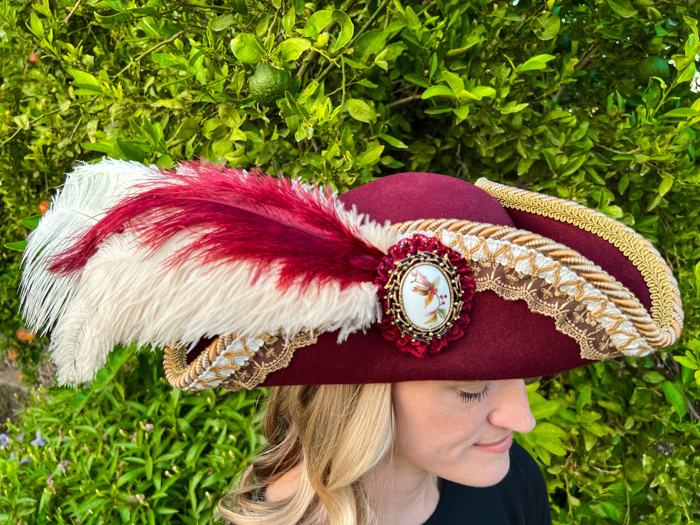 Tricorn Hat 21.75" Maroon Wool Base with Gold Trim, White Feathers, and Floral Brooch