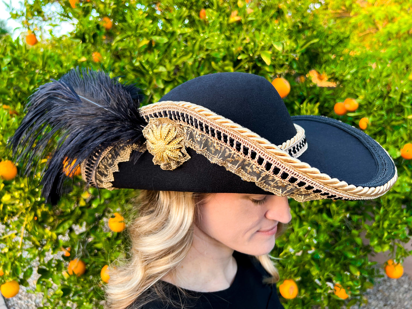 Cavalier Hat 23" Black Polyester Base with Gold Trim, Feathers, and Gold Brooch