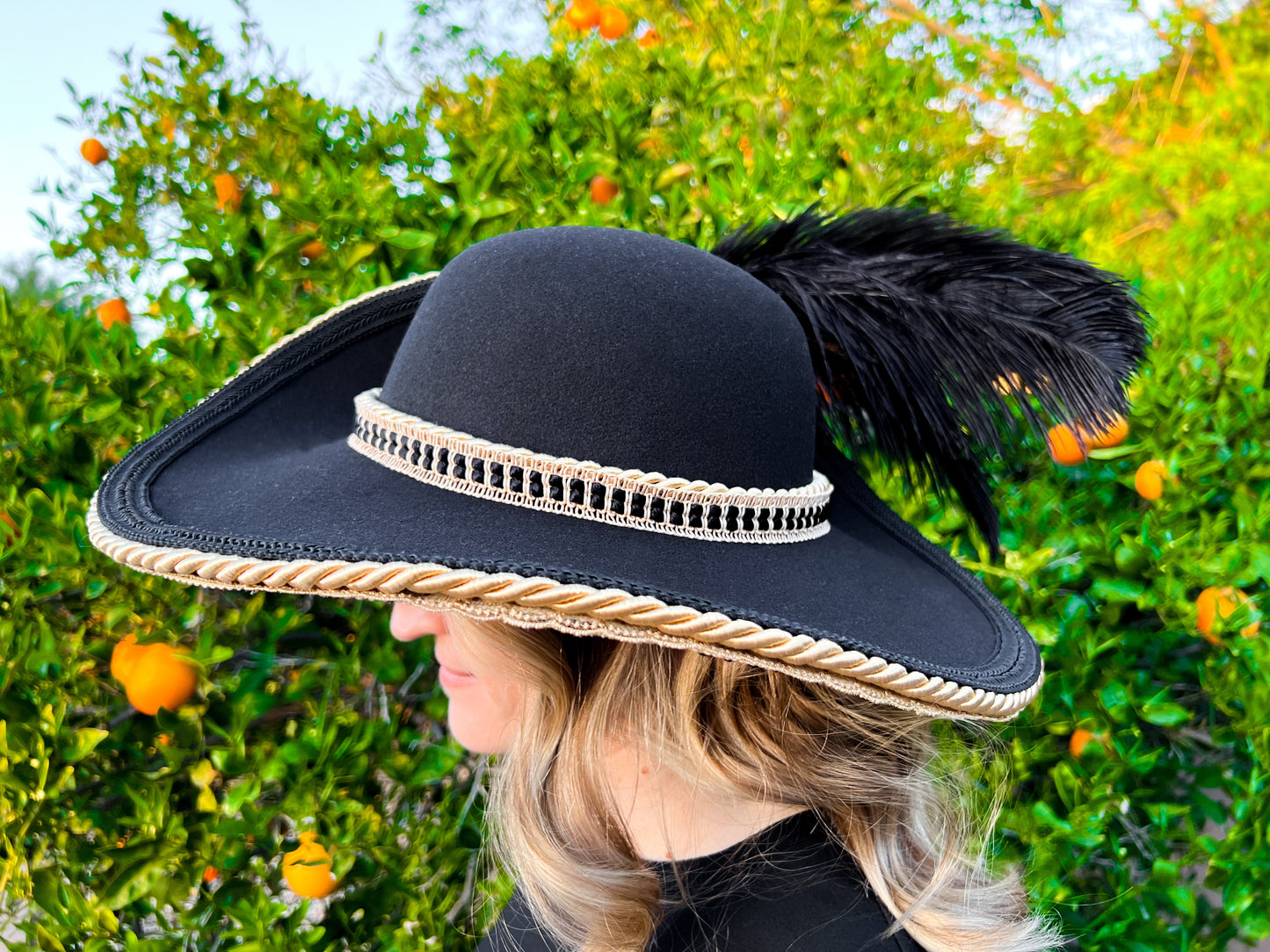 Cavalier Hat 23" Black Polyester Base with Gold Trim, Feathers, and Gold Brooch