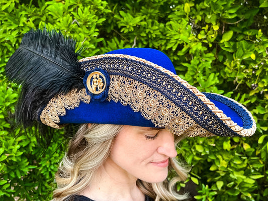 Cavalier Hat 22" Blue Wool Base with Antique Gold Trim, Feathers, and Brooch