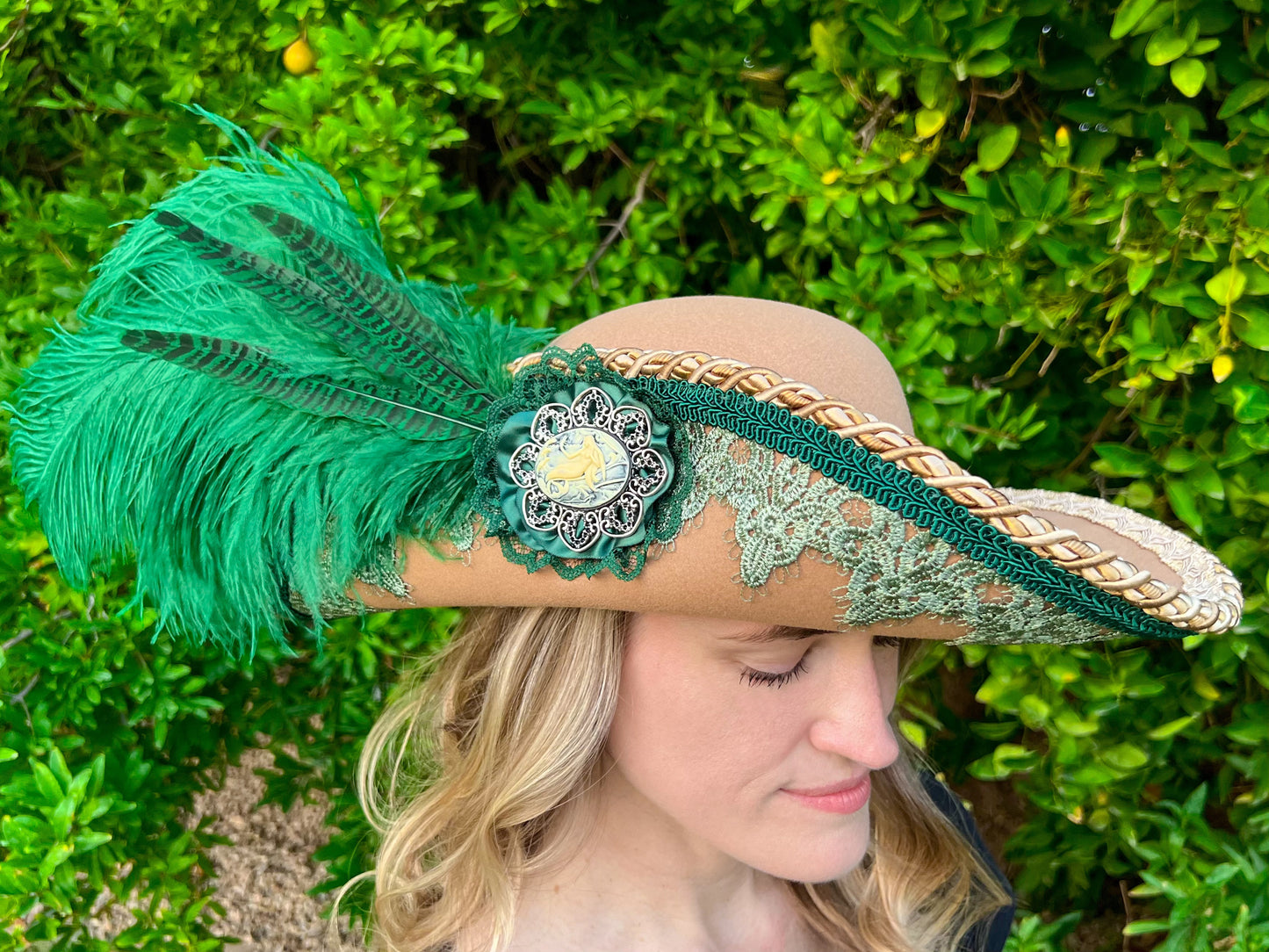 Cavalier Hat 22" Tan Polyester Base with Green Trim, Feathers, and Mermaid Brooch