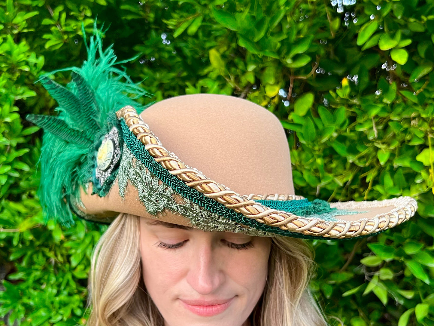 Cavalier Hat 22" Tan Polyester Base with Green Trim, Feathers, and Mermaid Brooch