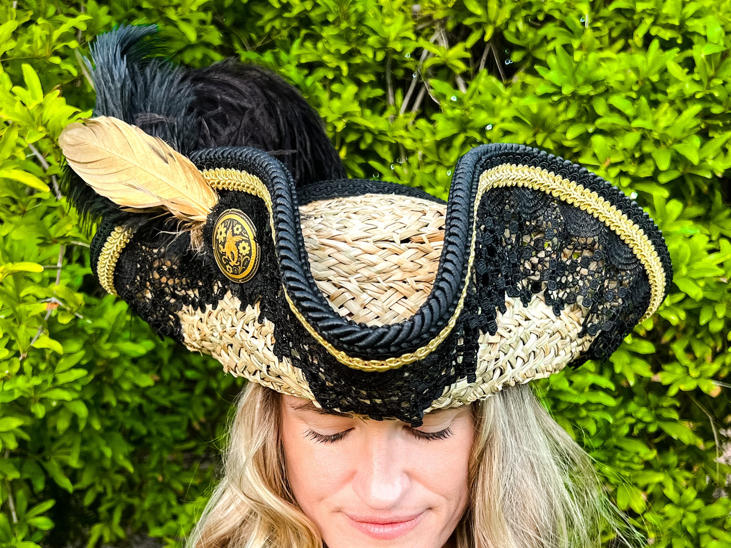 Tricorn Hat 22.5" Beige Straw Base with Black/Gold Trim, Feathers, and Brooch