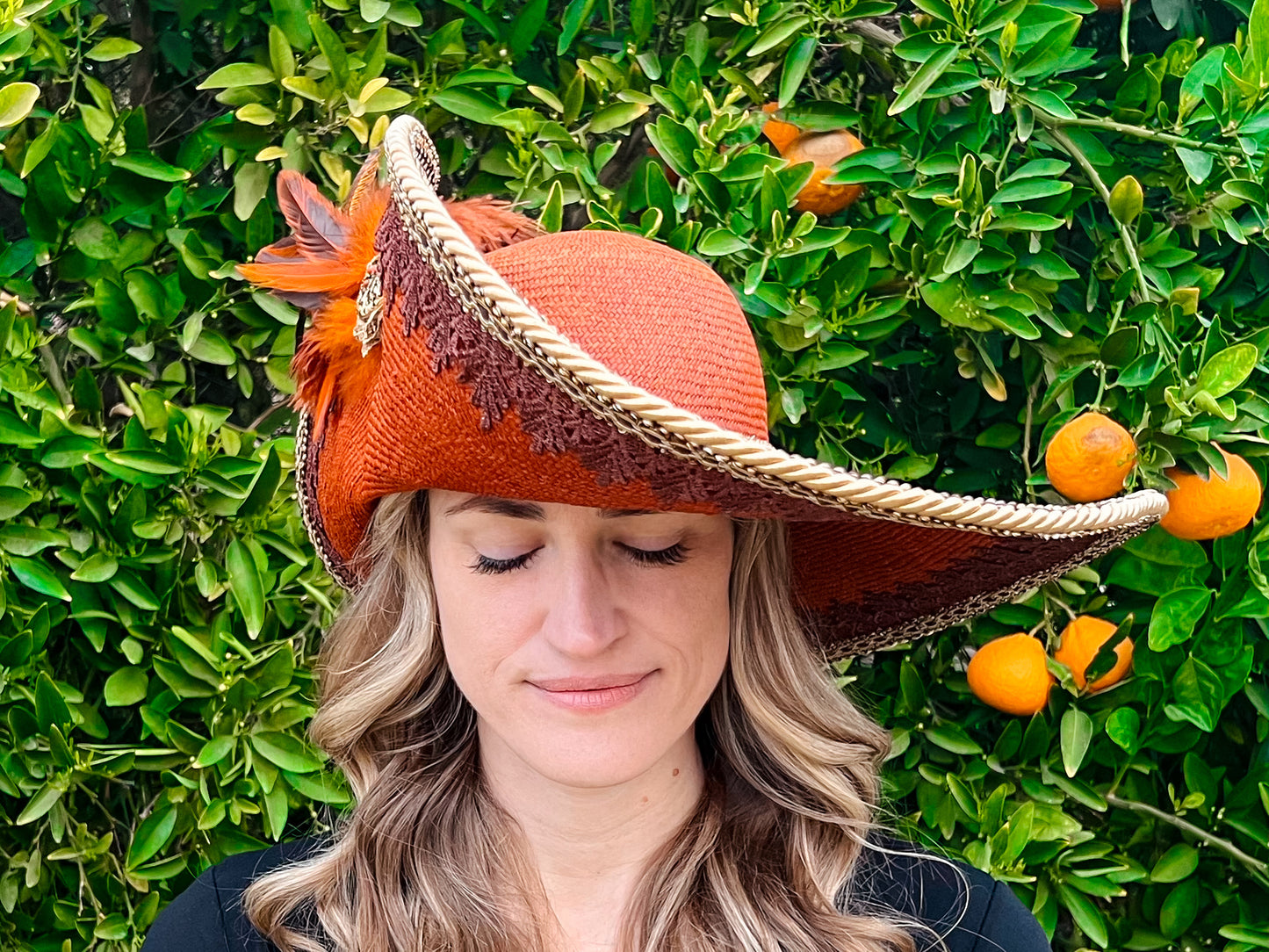 Cavalier Hat 22" Orange/Rust Straw Base with Brown Trim, Feathers, and Brooch