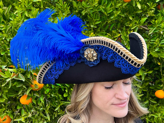 Tricorn Hat 23" Black Polyester Base with Royal Blue Trim, Feathers, and Brooch